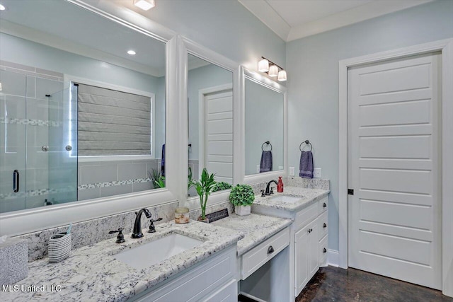 bathroom featuring vanity and an enclosed shower