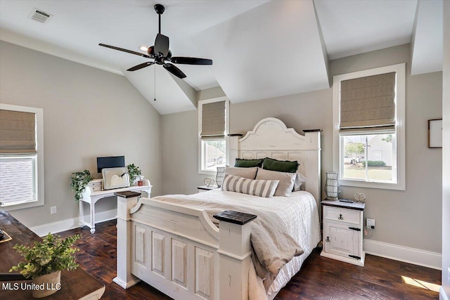 bedroom with multiple windows, dark wood-type flooring, lofted ceiling, and ceiling fan