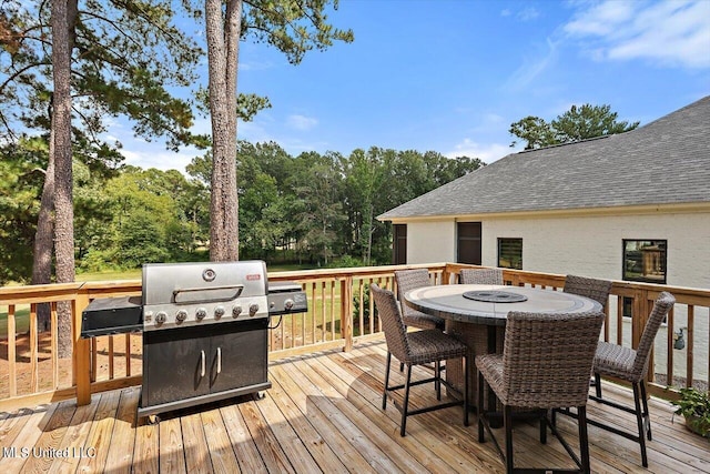 wooden terrace with a grill