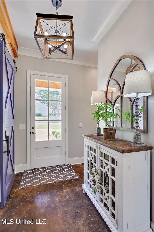 doorway featuring crown molding, a chandelier, and a barn door