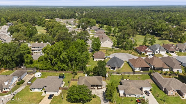 bird's eye view featuring a view of trees and a residential view