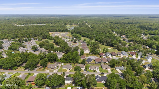 aerial view featuring a forest view and a residential view