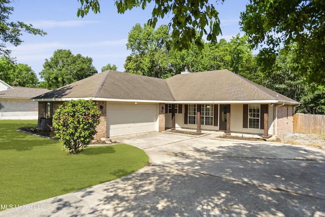 ranch-style house with an attached garage, brick siding, a porch, a front yard, and driveway