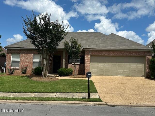 935 Frisky Dr, Brandon, MS 39047 - view of front of house featuring concrete driveway, a garage, brick siding, a front yard, and a shingled roof