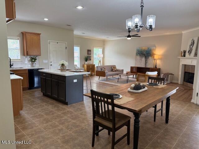 935 Frisky Dr, Brandon, MS 39047 - dining area with a chandelier, plenty of natural light, ornamental molding, recessed lighting, and a ceiling fan