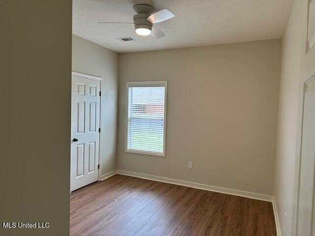935 Frisky Dr, Brandon, MS 39047 - empty room with ceiling fan, wood finished floors, and baseboards