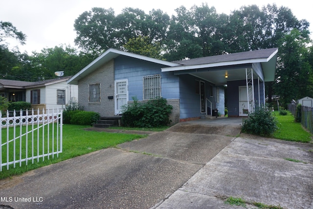 3828 California Ave, Jackson, MS 39213 - view of front of property featuring driveway and a carport