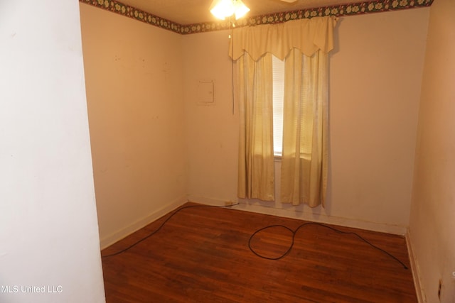 3828 California Ave, Jackson, MS 39213 - spare room with wood finished floors, baseboards, and a ceiling fan