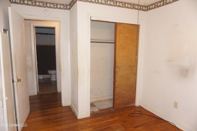 3828 California Ave, Jackson, MS 39213 - unfurnished bedroom with wood finished floors, baseboards, and a closet