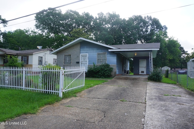 3828 California Ave, Jackson, MS 39213 - view of front of property with concrete driveway and an attached carport