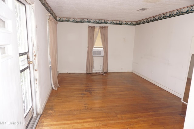 3828 California Ave, Jackson, MS 39213 - empty room featuring light wood-type flooring, baseboards, and cooling unit