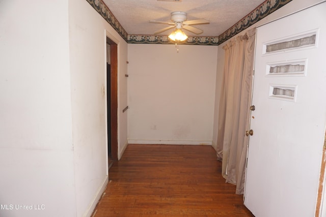 3828 California Ave, Jackson, MS 39213 - corridor with wood finished floors, baseboards, and a textured ceiling