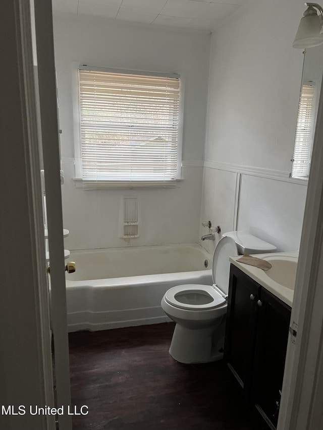 2643 Pinebrook Dr, Jackson, MS 39212 - bathroom with a bath, toilet, vanity, and wood finished floors