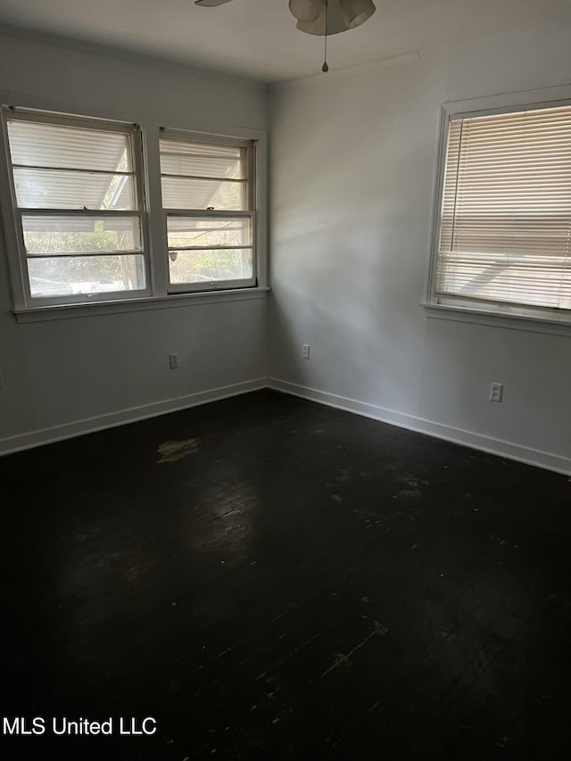 2643 Pinebrook Dr, Jackson, MS 39212 - unfurnished room with ceiling fan, dark wood finished floors, and baseboards