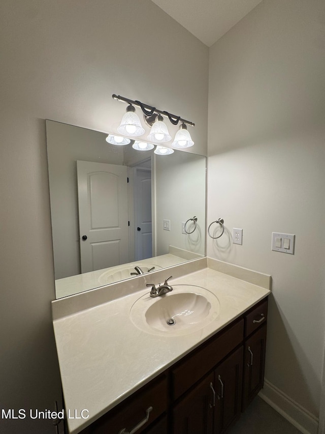 bathroom featuring vanity and baseboards