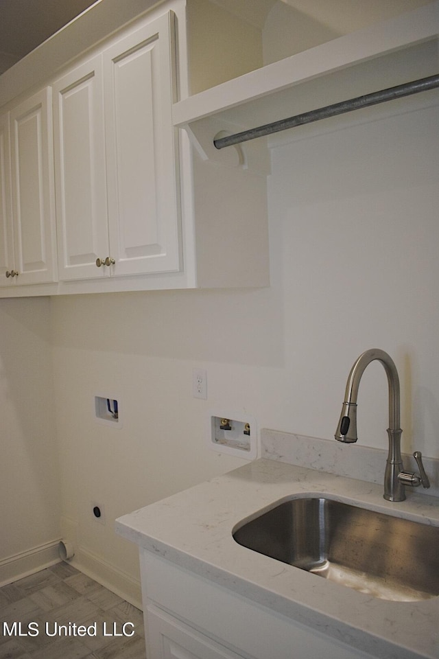 laundry room featuring cabinets, hookup for a washing machine, sink, and electric dryer hookup