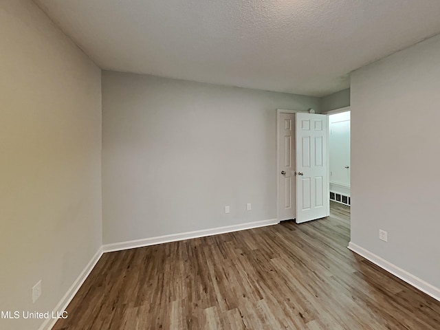 1764 Dorchester Dr, Southaven, MS 38671 - unfurnished room with dark wood finished floors and baseboards