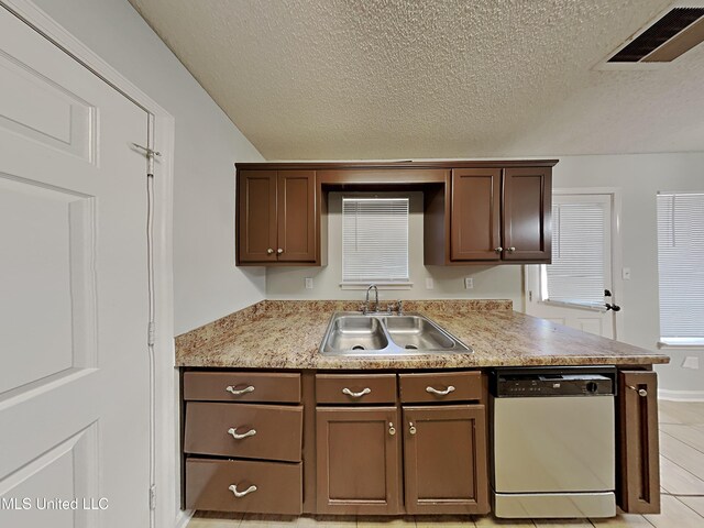 1764 Dorchester Dr, Southaven, MS 38671 - kitchen featuring white dishwasher, a sink, a textured ceiling, light countertops, and light tile patterned flooring