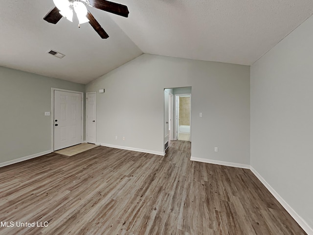 1764 Dorchester Dr, Southaven, MS 38671 - unfurnished room with a ceiling fan, wood finished floors, vaulted ceiling, and baseboards