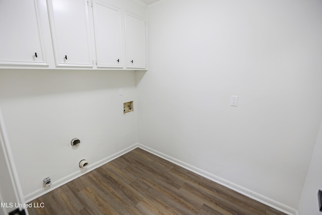 laundry area featuring dark wood-type flooring, baseboards, washer hookup, and cabinet space