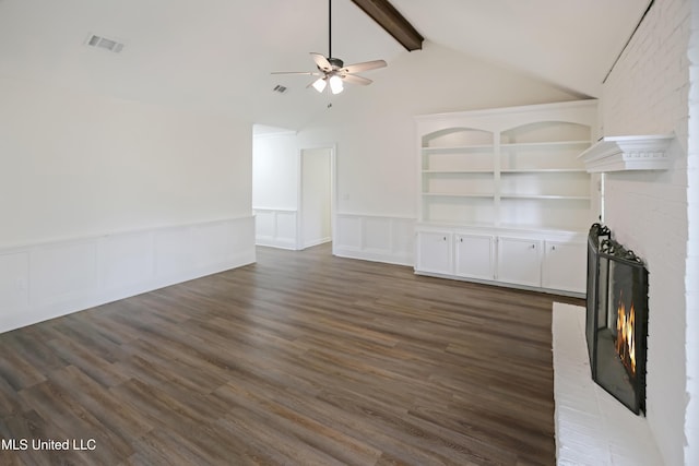 unfurnished living room featuring visible vents, dark wood finished floors, a ceiling fan, and a fireplace
