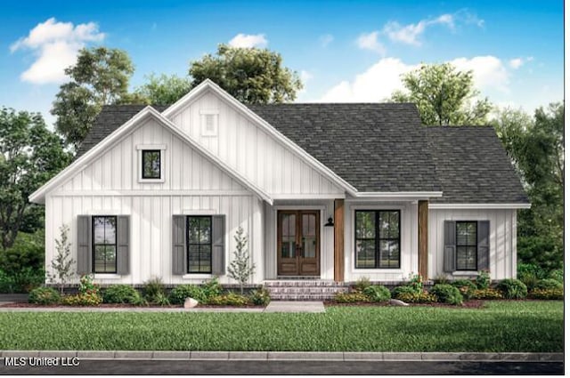 7356 Mockingbird Ln, Olive Branch, MS 38654 - view of front of home with french doors, roof with shingles, board and batten siding, and a front yard