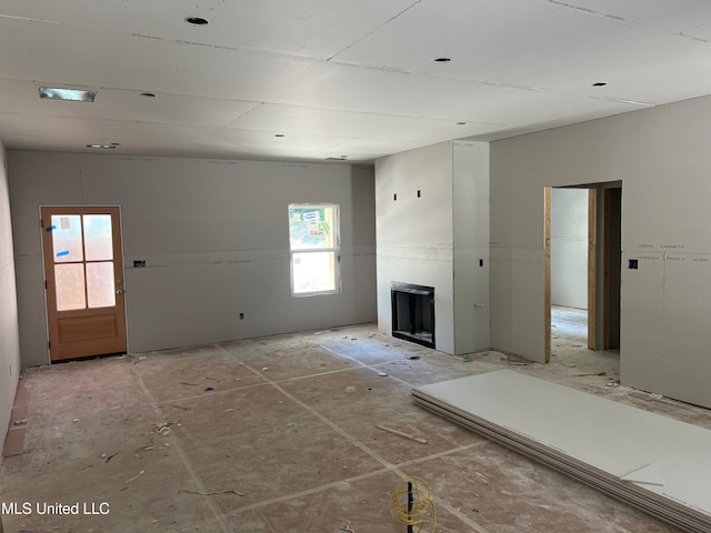 7356 Mockingbird Ln, Olive Branch, MS 38654 - unfurnished living room with a fireplace