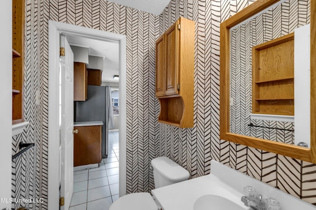 7105 Mandarin Dr, Biloxi, MS 39532 - bathroom with wallpapered walls, tile patterned flooring, and vanity