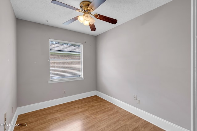 7105 Mandarin Dr, Biloxi, MS 39532 - unfurnished room with light wood-style floors, ceiling fan, and a textured ceiling