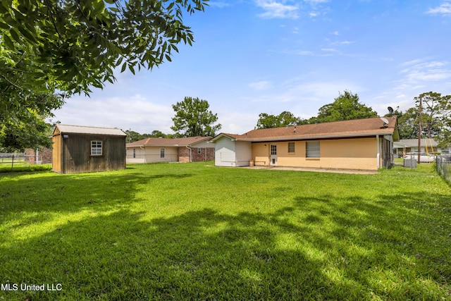 7105 Mandarin Dr, Biloxi, MS 39532 - back of house with a storage shed
