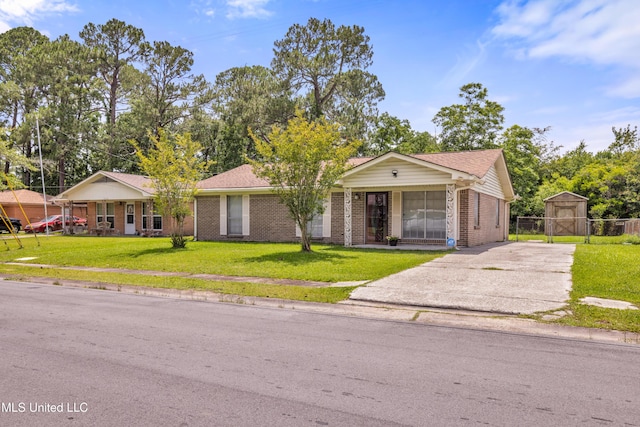 7105 Mandarin Dr, Biloxi, MS 39532 - ranch-style house with brick siding, driveway, and a shed