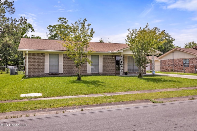 7105 Mandarin Dr, Biloxi, MS 39532 - ranch-style home featuring brick siding, a front yard, driveway, and an attached garage