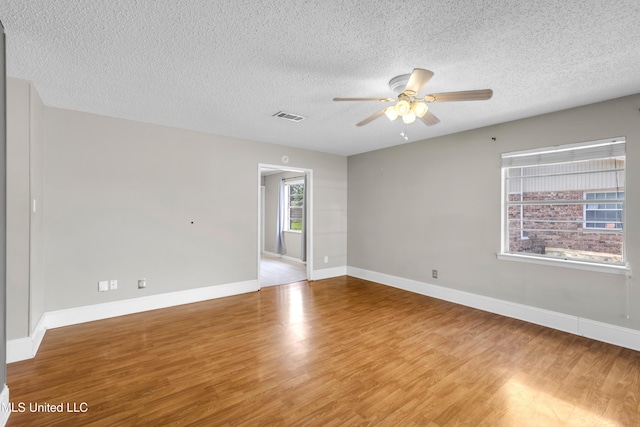 7105 Mandarin Dr, Biloxi, MS 39532 - unfurnished room with ceiling fan, a textured ceiling, and wood finished floors