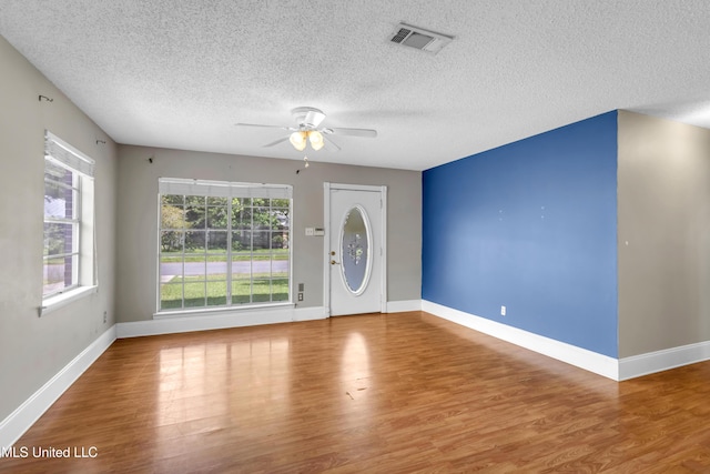 7105 Mandarin Dr, Biloxi, MS 39532 - entryway featuring ceiling fan, wood finished floors, and a textured ceiling