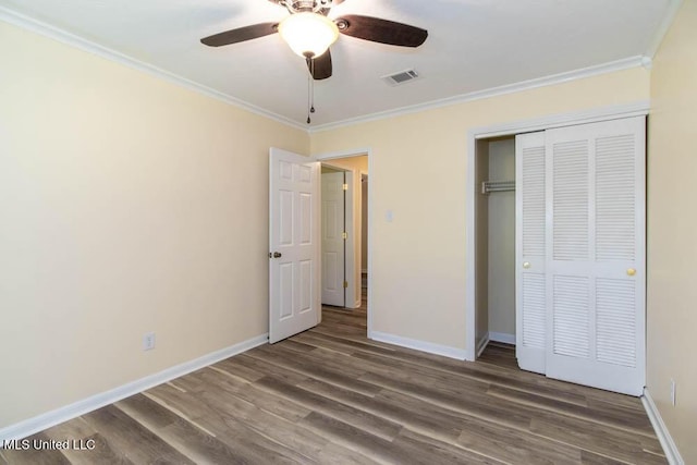 13128 Hanover Dr, Ocean Springs, MS 39564 - unfurnished bedroom featuring ornamental molding, wood finished floors, a closet, and a ceiling fan