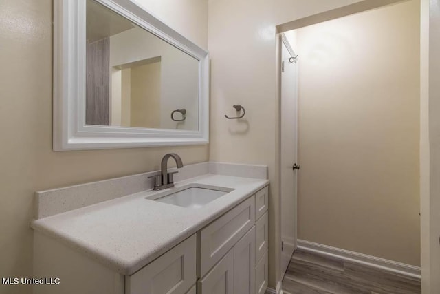 13128 Hanover Dr, Ocean Springs, MS 39564 - bathroom featuring wood finished floors and vanity