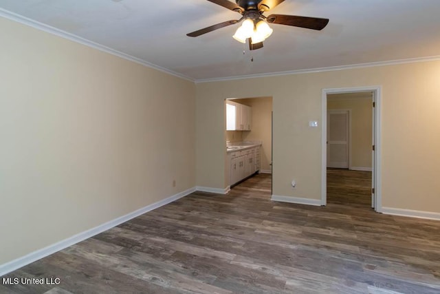 13128 Hanover Dr, Ocean Springs, MS 39564 - unfurnished room with ornamental molding, a ceiling fan, and dark wood-style flooring