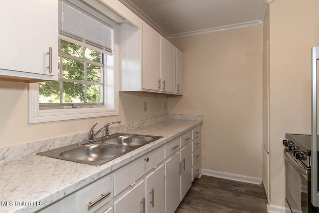 13128 Hanover Dr, Ocean Springs, MS 39564 - kitchen featuring stove, ornamental molding, light countertops, white cabinetry, and dark wood-style flooring