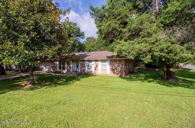 13128 Hanover Dr, Ocean Springs, MS 39564 - view of front of house with an attached garage, a front yard, brick siding, and driveway