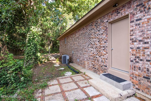 13128 Hanover Dr, Ocean Springs, MS 39564 - view of exterior entry featuring brick siding