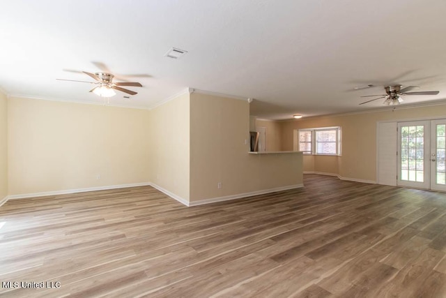13128 Hanover Dr, Ocean Springs, MS 39564 - empty room featuring a ceiling fan, ornamental molding, plenty of natural light, and light wood-style floors