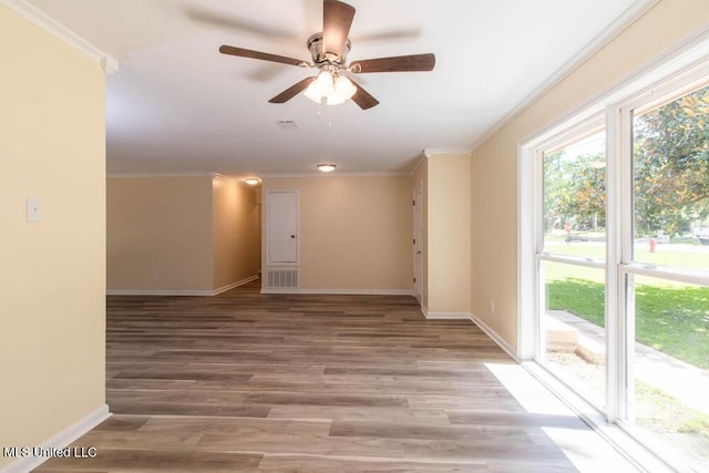 13128 Hanover Dr, Ocean Springs, MS 39564 - spare room featuring crown molding, light wood finished floors, and ceiling fan