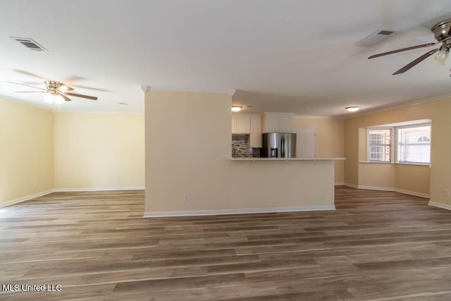 13128 Hanover Dr, Ocean Springs, MS 39564 - unfurnished living room with a ceiling fan, ornamental molding, and wood finished floors