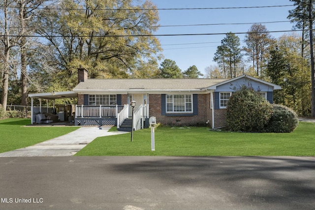 view of front of house featuring a front yard, crawl space, brick siding, and concrete driveway