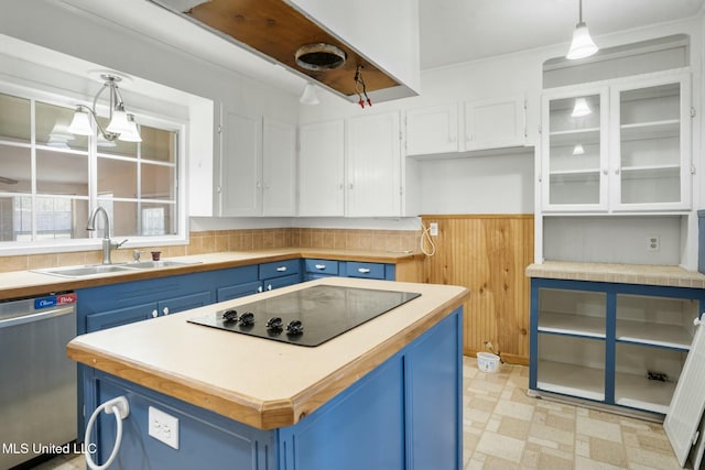 kitchen with black electric stovetop, stainless steel dishwasher, white cabinets, and blue cabinets