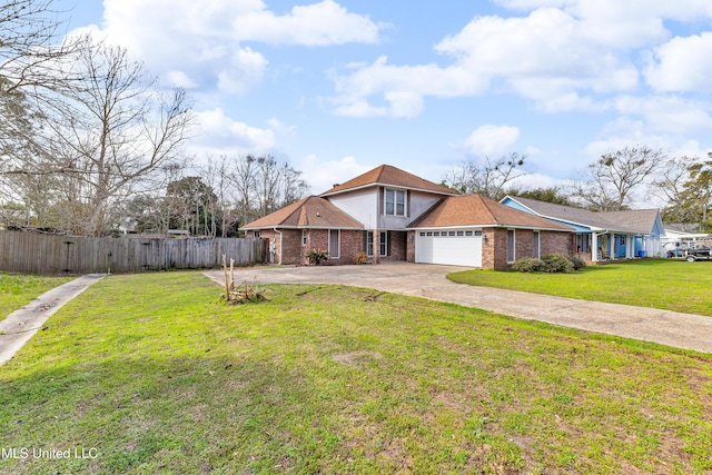 view of front of house with brick siding, concrete driveway, fence, and a front lawn