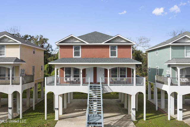 view of front property with covered porch and a carport