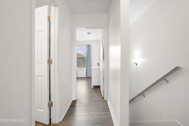 hall with dark wood-type flooring