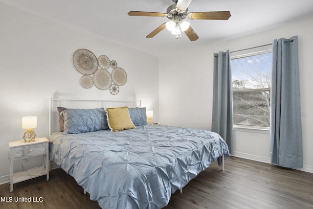 bedroom featuring ceiling fan and dark wood-type flooring