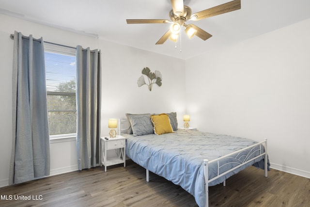 bedroom featuring ceiling fan and dark hardwood / wood-style flooring